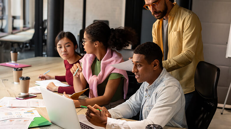 A group of people working together in an office.